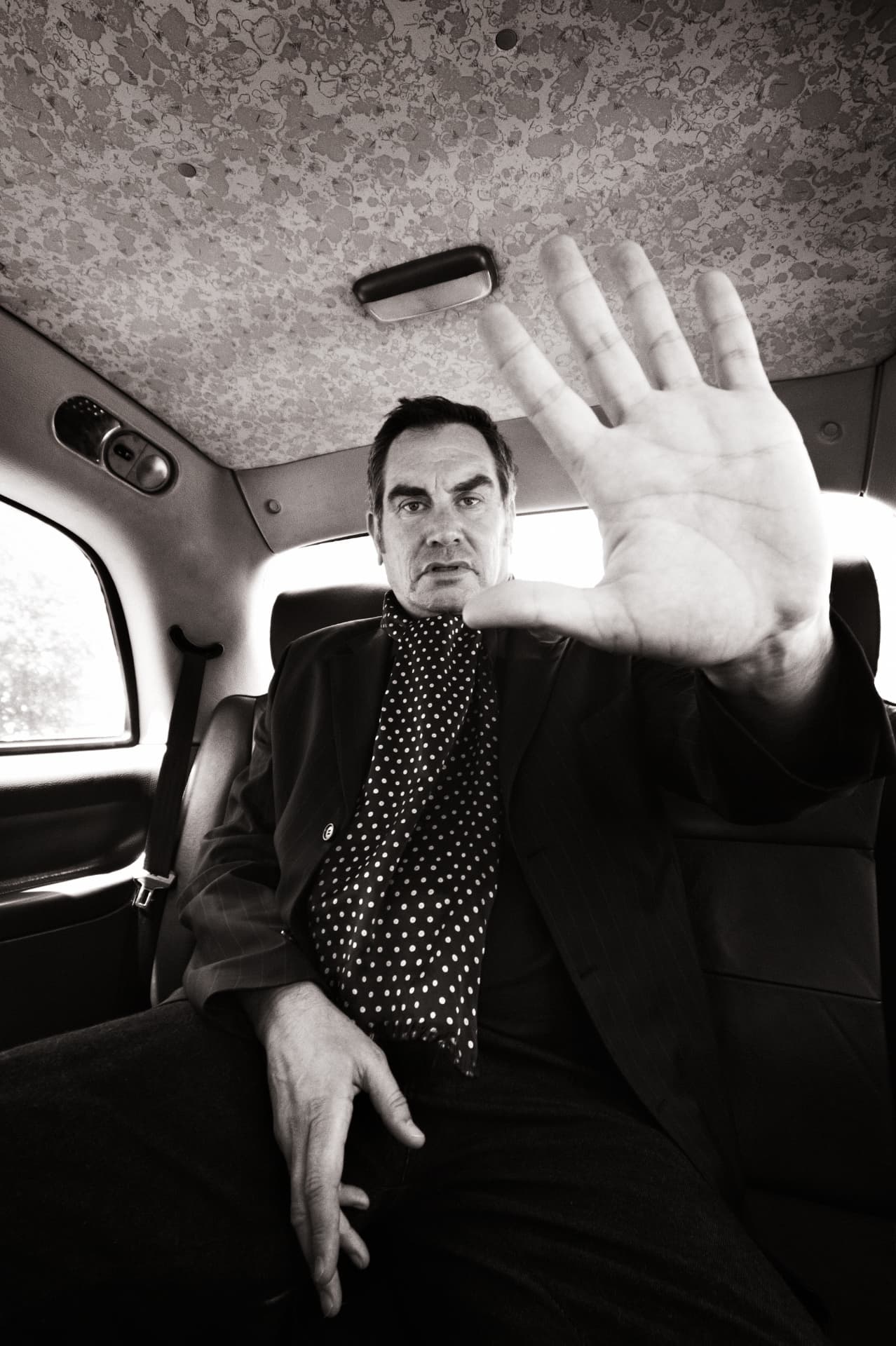 Mark Stewart photographed in the back of a London taxi